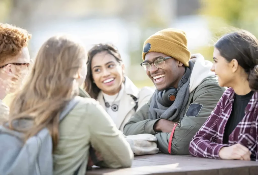 group of friends talking and laughing  mental health treatment in sacramento