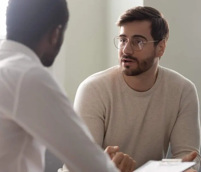 man talking with therapist about mental health disorders