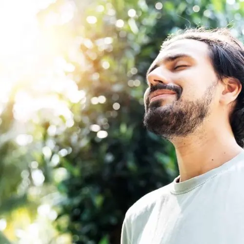 man practicing mindfulness outside