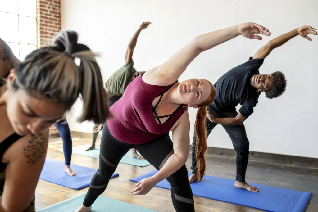 a group of people doing yoga