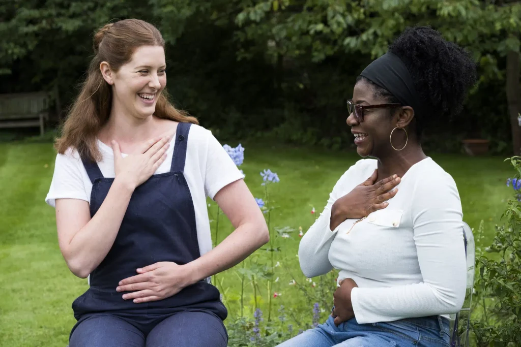 two women outside during humanistic therapy