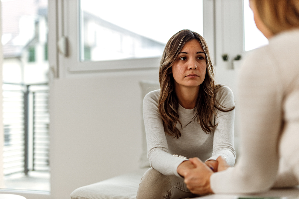 woman speaking to therapist during acceptance and commitment therapy