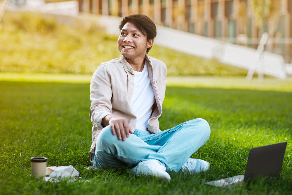 man with autism sitting in grass