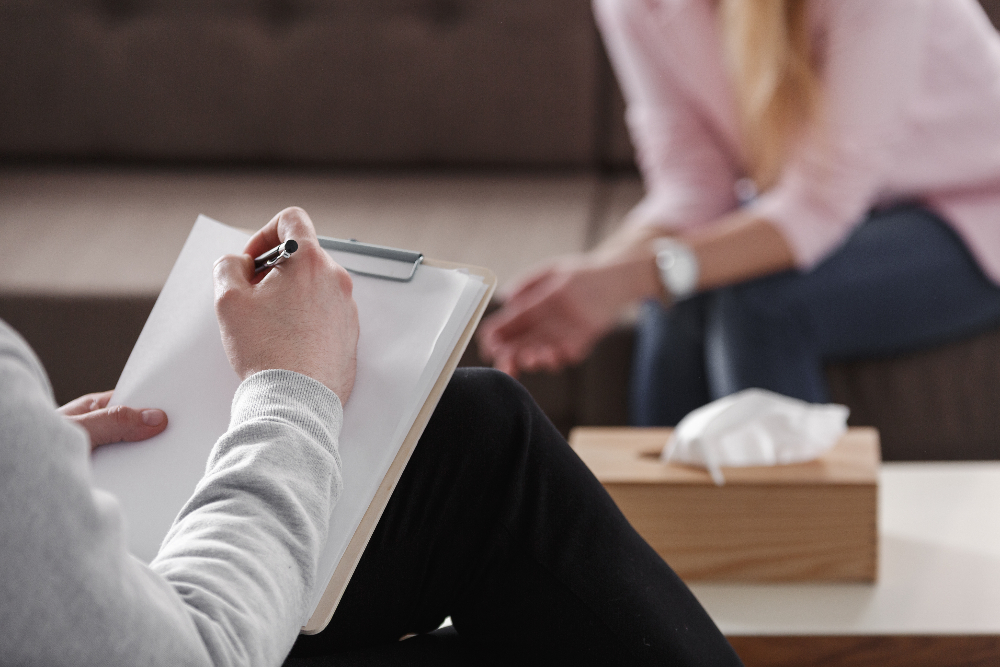 therapist giving patient an assessment