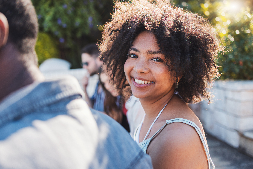 woman smiling after mental health treatment