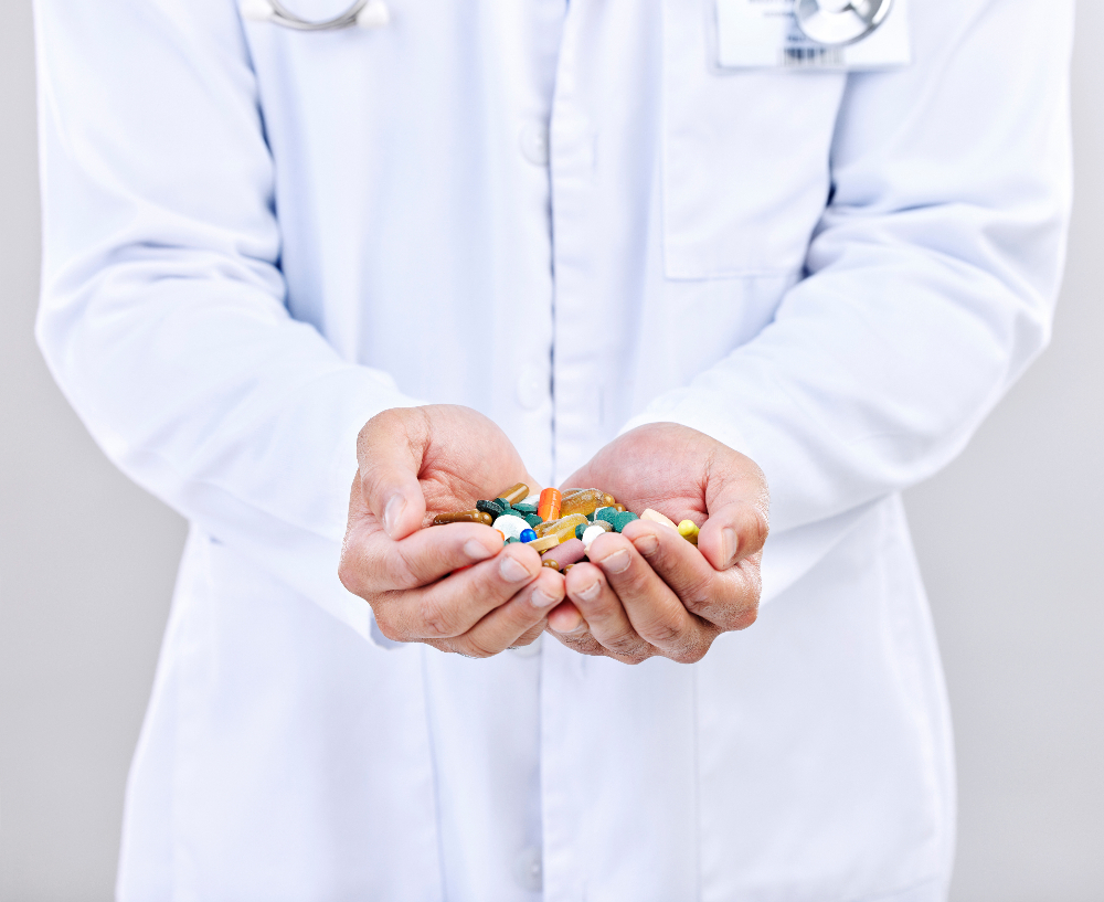 medication managment  doctor holding medications