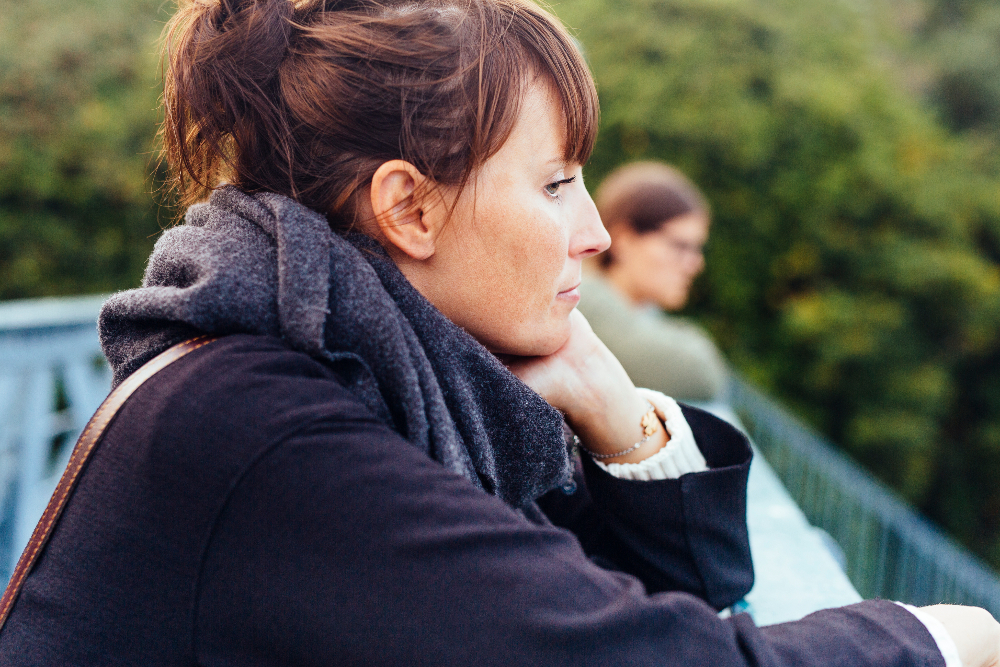 woman with major depressive disorder standing outside