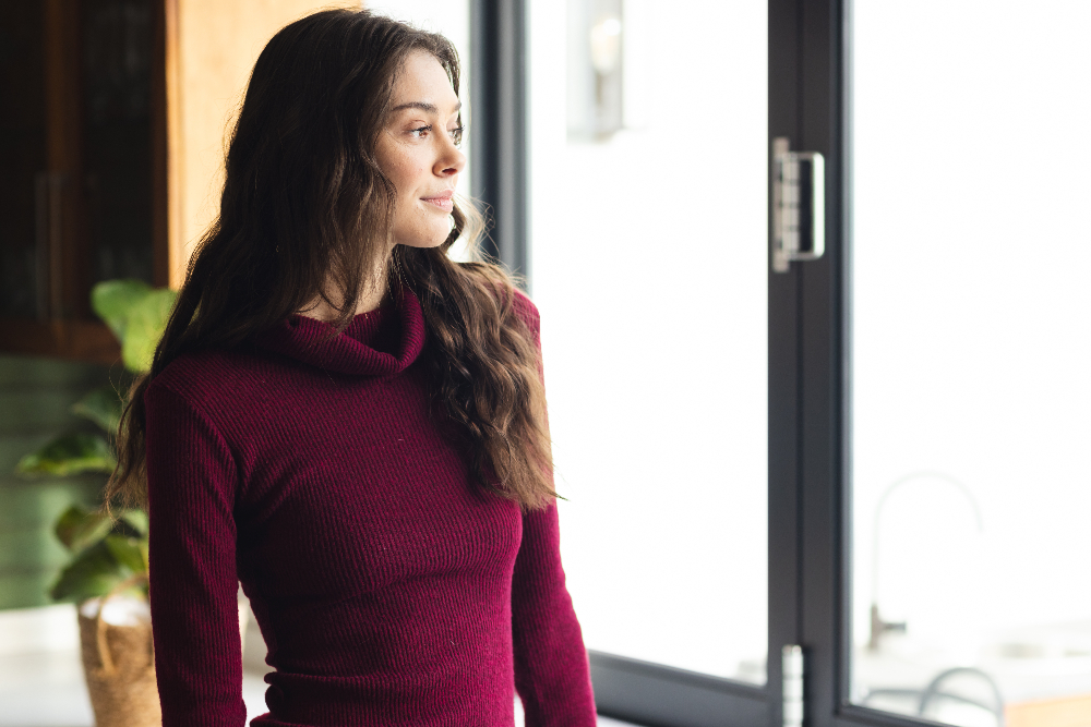 woman with obsessive compulsive disorder looking out a window