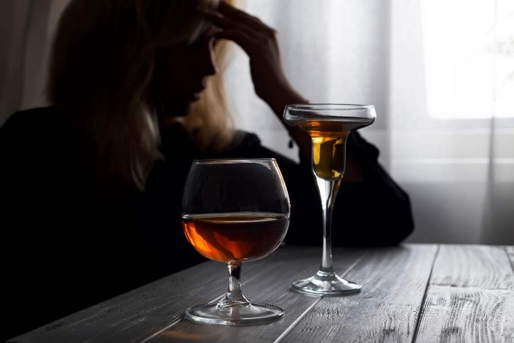 woman with co occurring disorder drinking alcohol and depressed