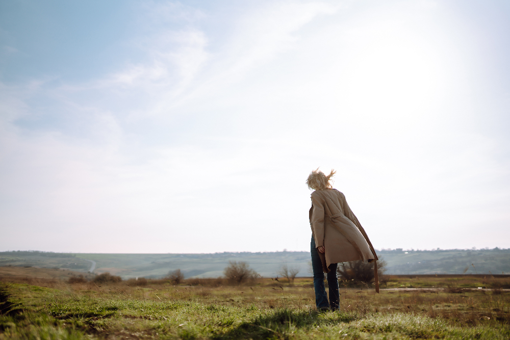 woman outside looking over ocean humanistic therapy