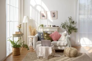 A bright, calm living room with soft natural light and comfortable seating