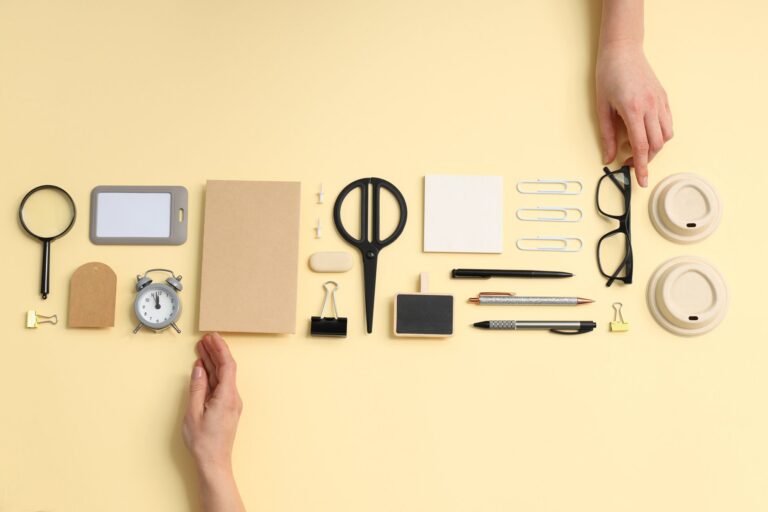 Hands arranging objects neatly in an orderly row