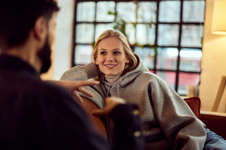 Two individuals engaged in a friendly conversation