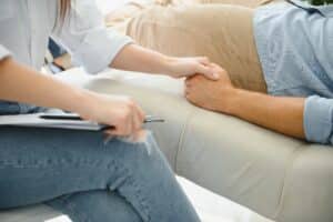 A therapist offering reassurance to a client during a counseling session
