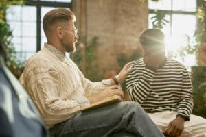 One person comforting another during a supportive counseling session