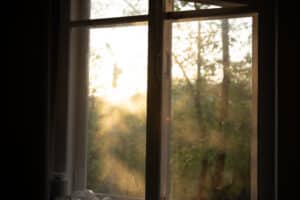 Warm morning sunlight streaming through an open window